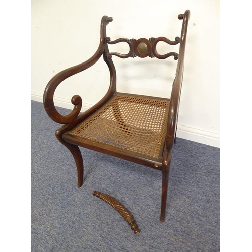 768 - An early 19th century grained (to look like rosewood) open-armed dining chair; the rope-style top-ra... 