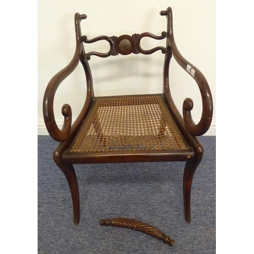 768 - An early 19th century grained (to look like rosewood) open-armed dining chair; the rope-style top-ra... 