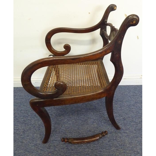 768 - An early 19th century grained (to look like rosewood) open-armed dining chair; the rope-style top-ra... 