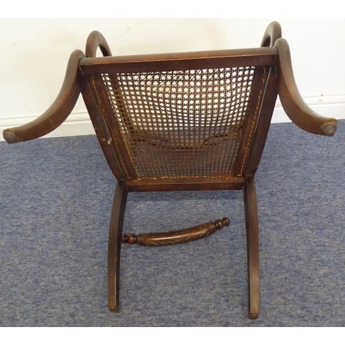 768 - An early 19th century grained (to look like rosewood) open-armed dining chair; the rope-style top-ra... 