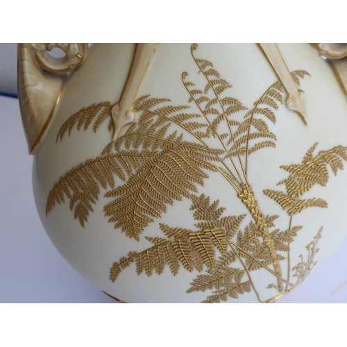 8 - A late 19th century Worcester blush porcelain vase; flaring reticulated top above two ornate handles... 