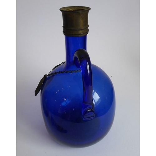 84 - Two 19th century cranberry glass flasks; one with 'Brandy' ticket, together with a spherical cobalt ... 