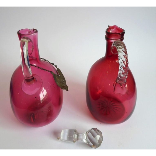 84 - Two 19th century cranberry glass flasks; one with 'Brandy' ticket, together with a spherical cobalt ... 