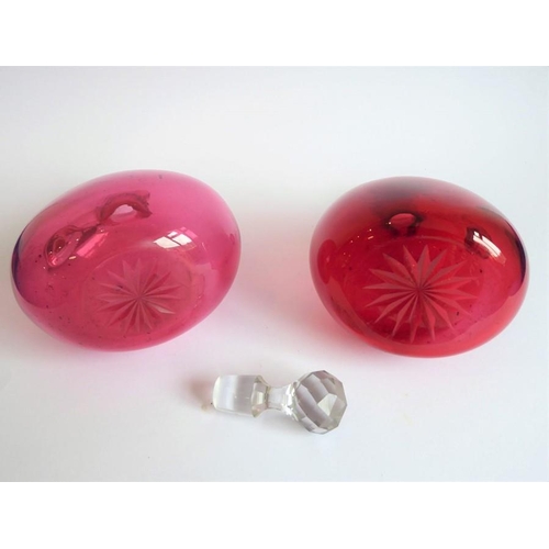 84 - Two 19th century cranberry glass flasks; one with 'Brandy' ticket, together with a spherical cobalt ... 