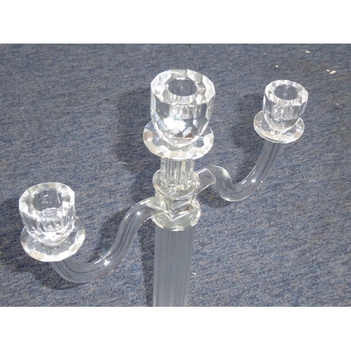 86A - A fine hand-cut three light crystal table candelabra; fluted stem and on facet-cut angular base (40c... 