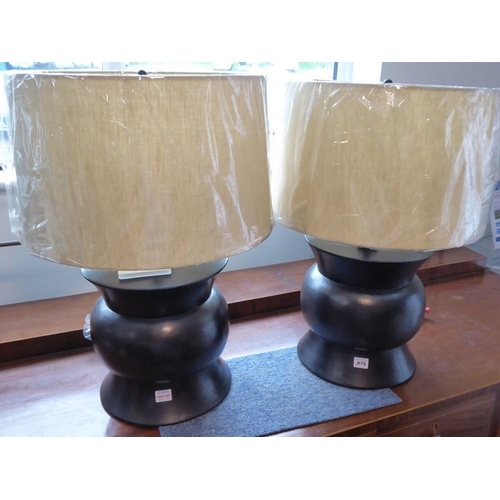 875 - A pair of Robert Kuo copper repoussé 'Zun' lamps for McGuire Furniture Company; the lamps unused and... 