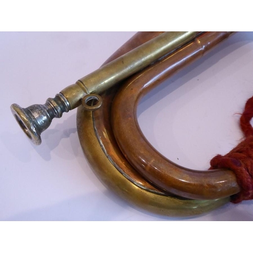 88 - A brass mounted copper bugle; signed 'Barratts, England', together red rope tassels and detachable s... 