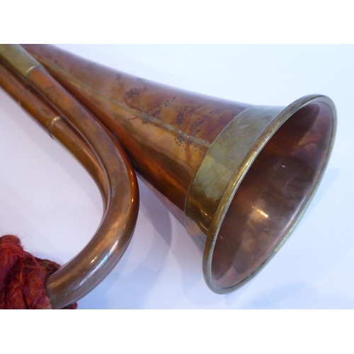 88 - A brass mounted copper bugle; signed 'Barratts, England', together red rope tassels and detachable s... 