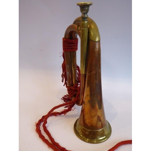 88 - A brass mounted copper bugle; signed 'Barratts, England', together red rope tassels and detachable s... 