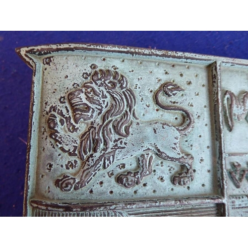 91 - A very heavy solid patinated bronze wall mounting armorial crest; of shield design and with lion ram... 