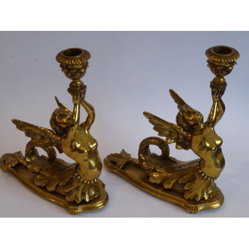 92 - A fine pair of heavy early/mid-19th century lacquered gilt-bronze figural candlesticks; two winged f... 