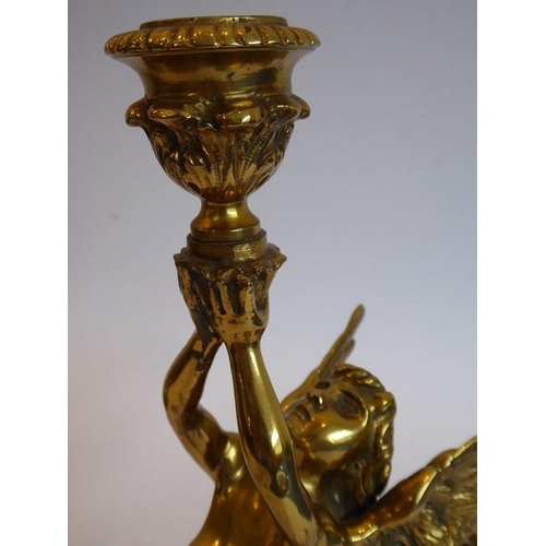 92 - A fine pair of heavy early/mid-19th century lacquered gilt-bronze figural candlesticks; two winged f... 