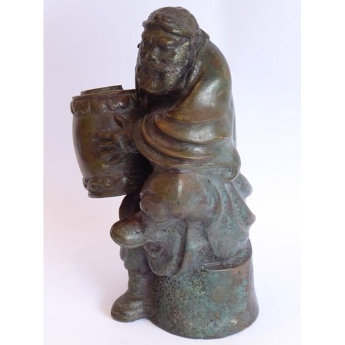 97 - An 18th/19th century well-patinated heavy Chinese bronze; the seated bearded figure with finely cast... 