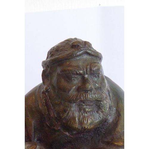 97 - An 18th/19th century well-patinated heavy Chinese bronze; the seated bearded figure with finely cast... 