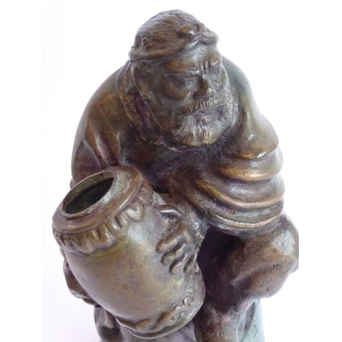 97 - An 18th/19th century well-patinated heavy Chinese bronze; the seated bearded figure with finely cast... 