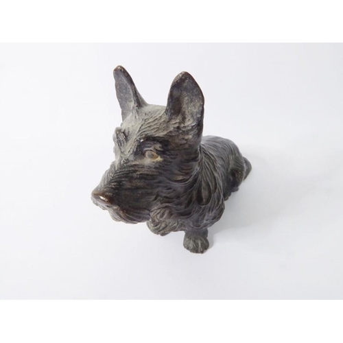 100 - A well modelled and heavy patinated bronze model of a seated Scottie dog (approx. 368g, 9.75cm long ... 