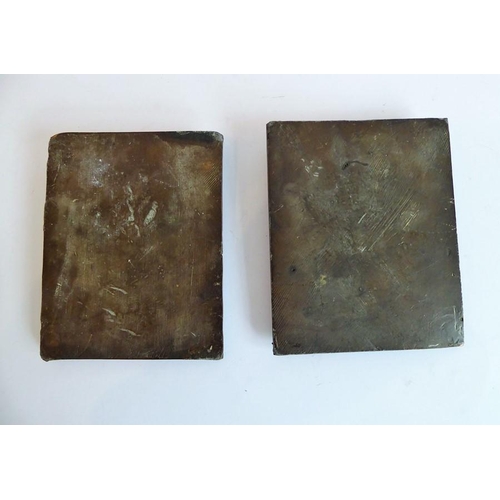 102 - A pair of late 19th/early 20th century patinated bronze shoulder-length portrait studies in relief; ... 