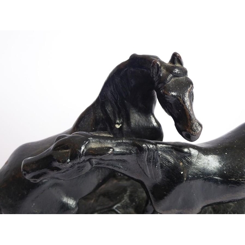 111 - A 20th century Russian painted, cast-iron sculpture model of two horses; marks to underside and date... 