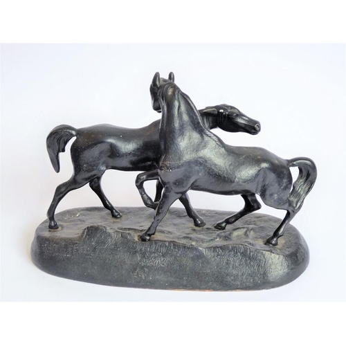 111 - A 20th century Russian painted, cast-iron sculpture model of two horses; marks to underside and date... 