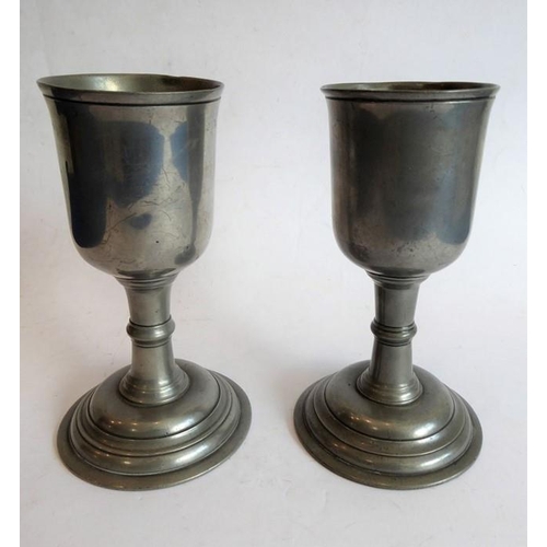 113 - A pair of pewter goblets in early 18th century style and with circular spreading feet (18cm high)