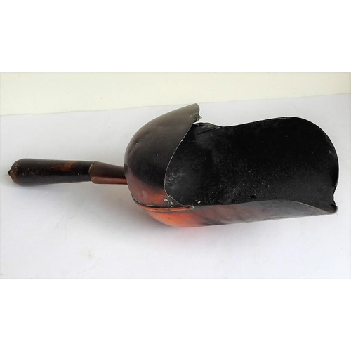 115 - A 19th century helmet-shaped copper coal scuttle and scoop