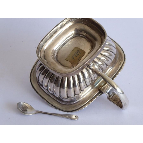 118 - An early 19th century hallmarked silver mustard; boat-shaped with lobed lid and lower body raised on... 