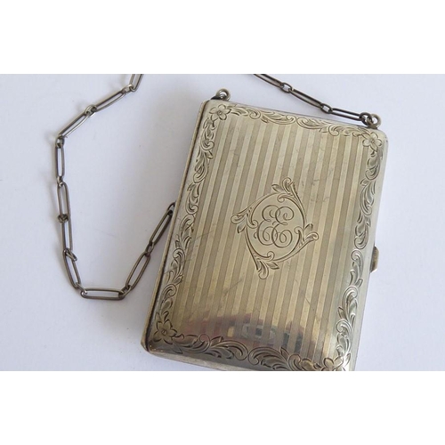 120 - A late 19th century silver aide-mémoire dress purse on chain; the central cartouche engraved with a ... 