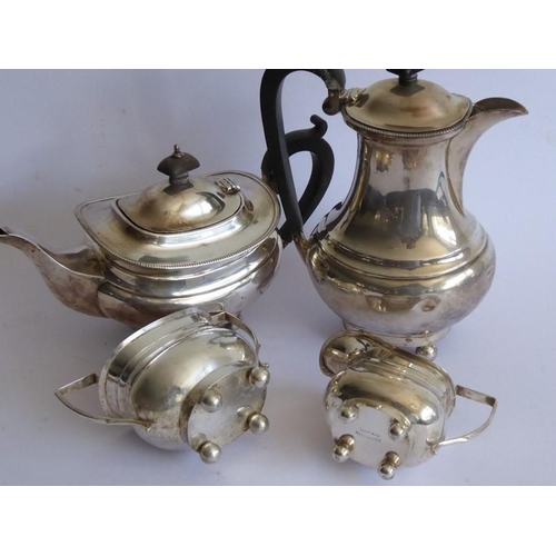 124 - An early 20th century four piece hallmarked silver tea service comprising teapot, two-handled sugar,... 