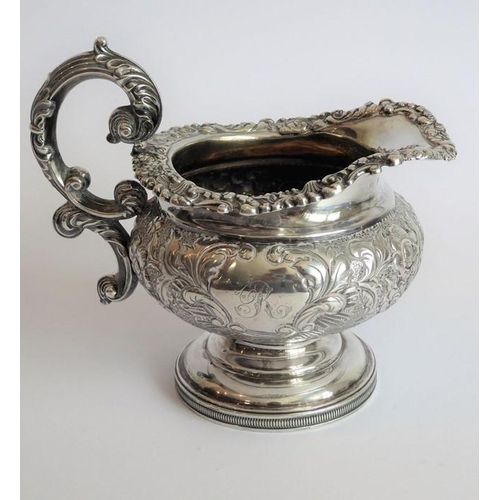 129 - A heavy early 19th century hallmarked silver three-piece tea service: teapot, large two-handled suga... 