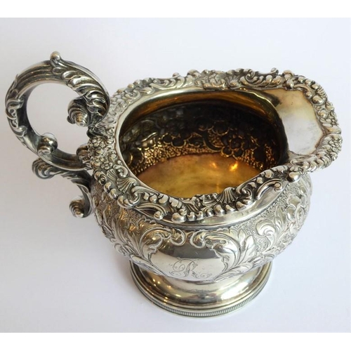 129 - A heavy early 19th century hallmarked silver three-piece tea service: teapot, large two-handled suga... 