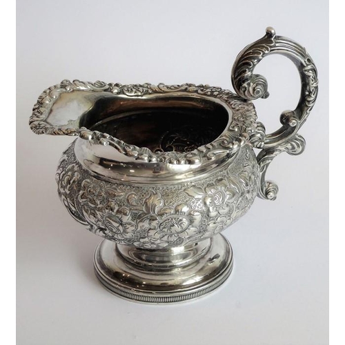 129 - A heavy early 19th century hallmarked silver three-piece tea service: teapot, large two-handled suga... 