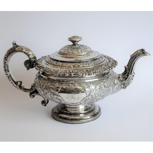 129 - A heavy early 19th century hallmarked silver three-piece tea service: teapot, large two-handled suga... 