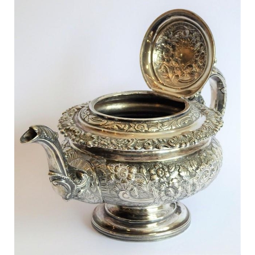 129 - A heavy early 19th century hallmarked silver three-piece tea service: teapot, large two-handled suga... 