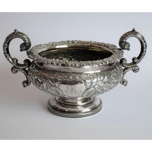 129 - A heavy early 19th century hallmarked silver three-piece tea service: teapot, large two-handled suga... 