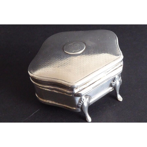 136 - A hallmarked silver jewellery/trinket box; serpentine-fronted, lined with blue velvet and raised on ... 