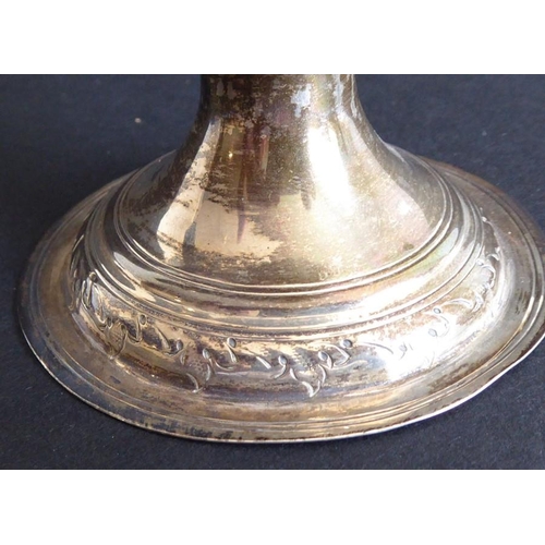 137 - An 18th century hallmarked silver two-handled trophy-style cup; later Repoussé decorated and with in... 