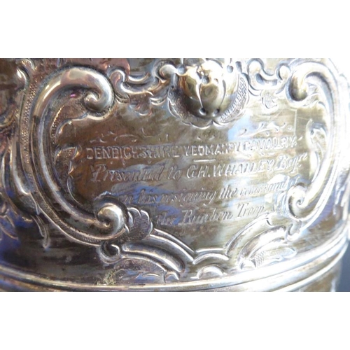 137 - An 18th century hallmarked silver two-handled trophy-style cup; later Repoussé decorated and with in... 