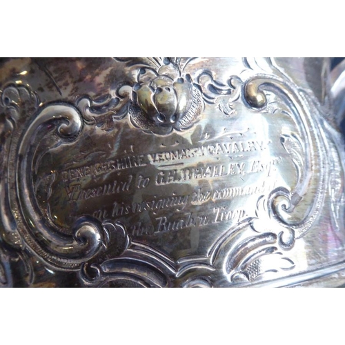 137 - An 18th century hallmarked silver two-handled trophy-style cup; later Repoussé decorated and with in... 