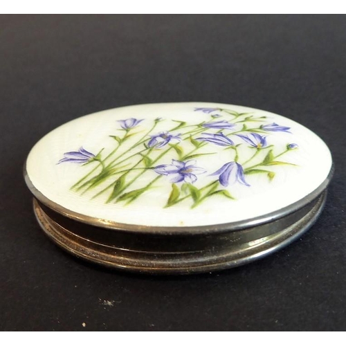 139 - An early 20th century white-metal powder compact with mirror; the hinged lid decorated in guilloche ... 