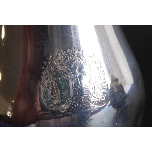 140 - A hallmarked silver 'sparrow beak' jug, in 18th century style, engraved with armorial crest and assa... 