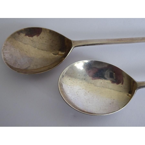 141 - Two early-style hallmarked silver (17th/18th century) seal top spoons; the slightly larger (18cm) wi... 