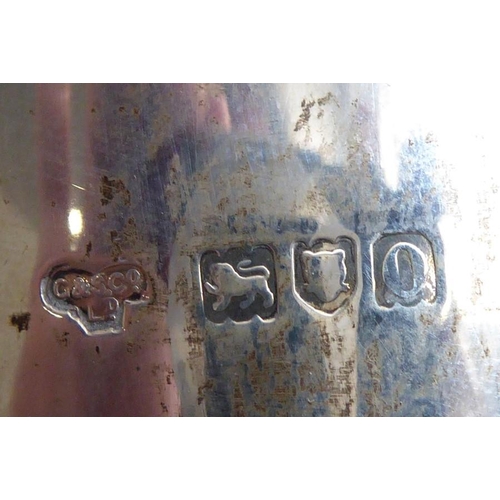 143 - A hallmarked silver coffee pot marked for 'Goldsmiths & Silversmiths Co., Regent Street', assayed Lo... 