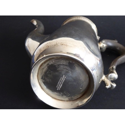 143 - A hallmarked silver coffee pot marked for 'Goldsmiths & Silversmiths Co., Regent Street', assayed Lo... 