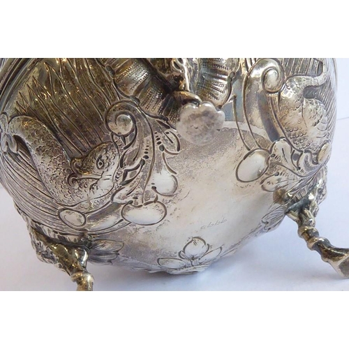 144 - Three pieces of hallmarked silver: a 19th century cauldron-shaped sugar bowl decorated in repoussé s... 