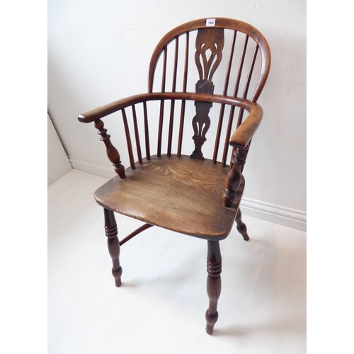 766 - A mid-19th century yew wood Windsor chair; pierced shaped splat, shaped elm seat and turned slightly... 