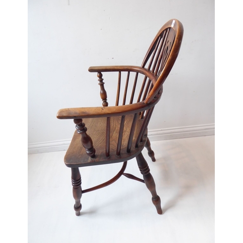 766 - A mid-19th century yew wood Windsor chair; pierced shaped splat, shaped elm seat and turned slightly... 