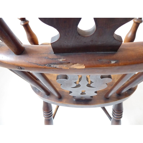 767 - A mid-19th century yew wood Windsor chair; having pierced splat, shaped elm seat and turned legs uni... 