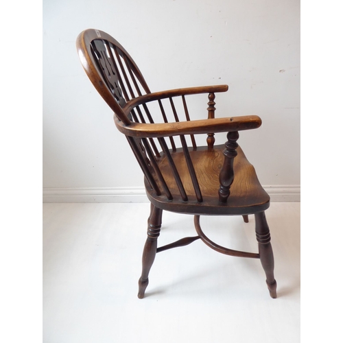 767 - A mid-19th century yew wood Windsor chair; having pierced splat, shaped elm seat and turned legs uni... 