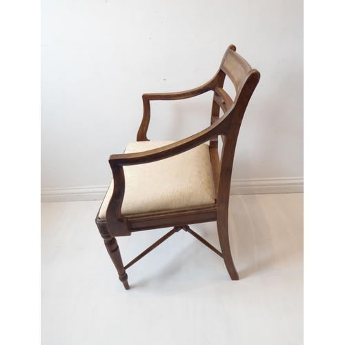 765 - A single early 19th century Regency period mahogany open armchair; the figured tablet shaped concave... 