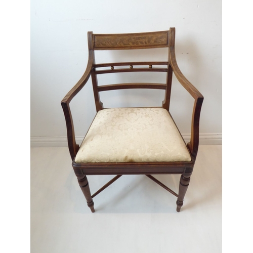 765 - A single early 19th century Regency period mahogany open armchair; the figured tablet shaped concave... 